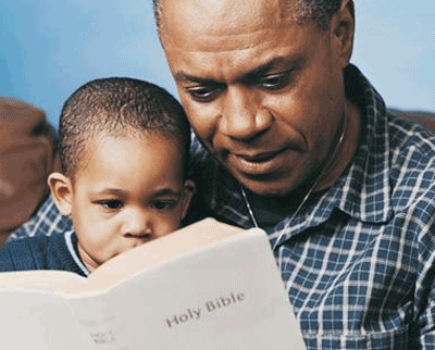 father and son reading Scripture